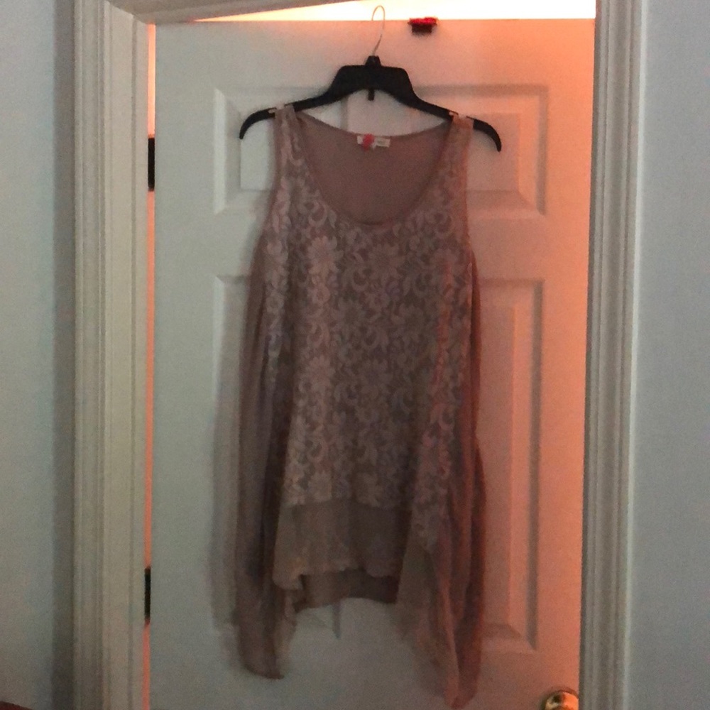 Ladies blouse with a draped bottom.